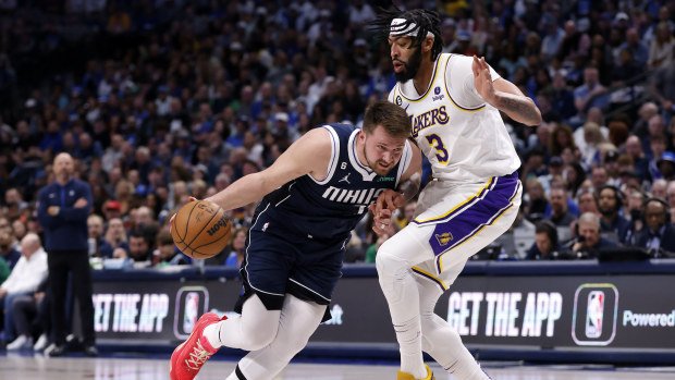 Luka Doncic of the Mavericks handles the ball against Anthony Davis of the Lakers.