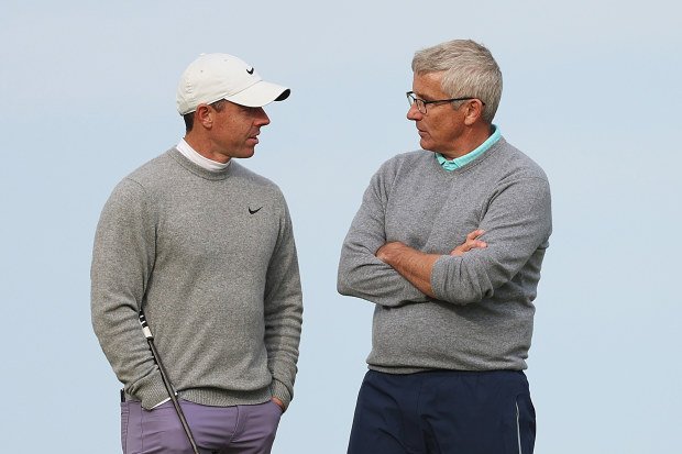 Rory McIlroy speaks with PGA Tour boss Jay Monahan.