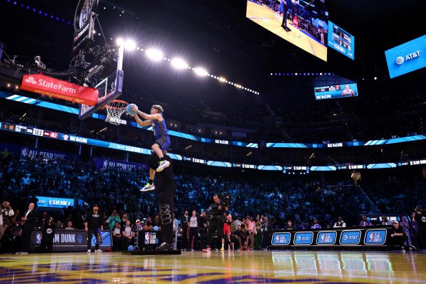 Mac McClung #8 of the Orlando Magic dunks the ball.
