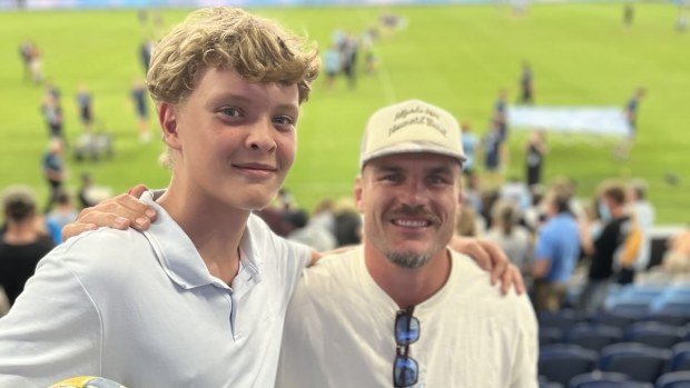 Manly junior Axel meets NRL star Angus Crichton at the Waratahs game.