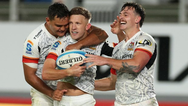 Damian McKenzie of the Chiefs celebrates after scoring a try.