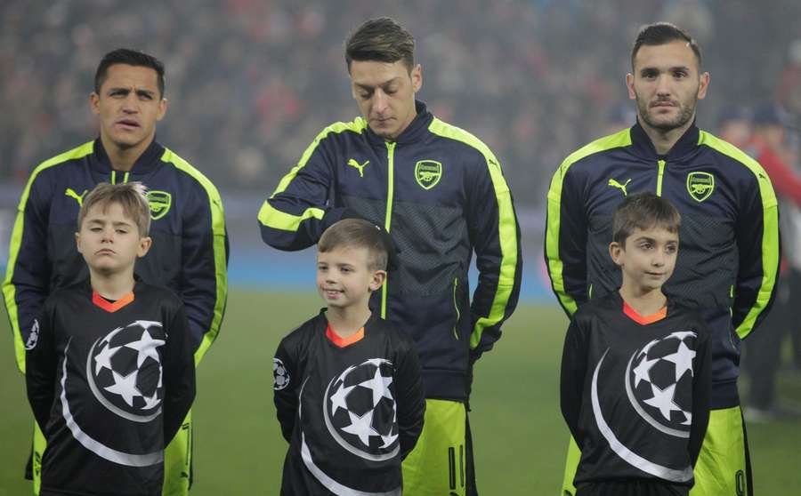 Lucas Perez (R) with Alexis Sanchez and Mesut Ozil prior to Arsenal's Champions League clash against FC Basel in December 2016