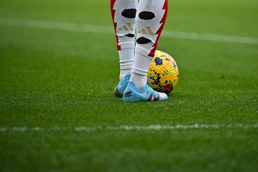 The socks with holes of Arsenal's English forward Bukayo Saka during the English Premier League match against Crystal Palace at Emirates Stadium on January 20, 2024.