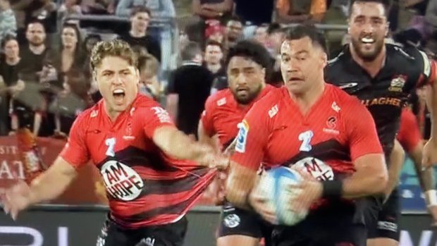 James O'Connor is held back by Josh Lord.