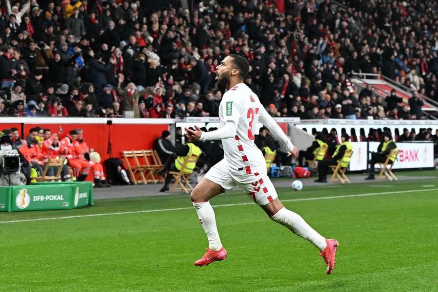 Linton Maina celebrates after scoring FC Koln's second goal against Bayer Leverkusen