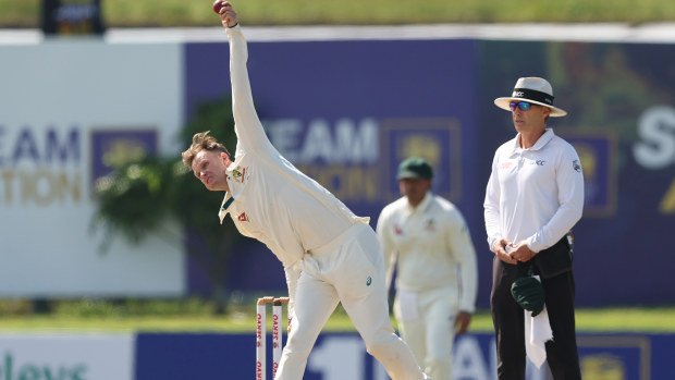 Matt Kuhnemann from Australia bowling.