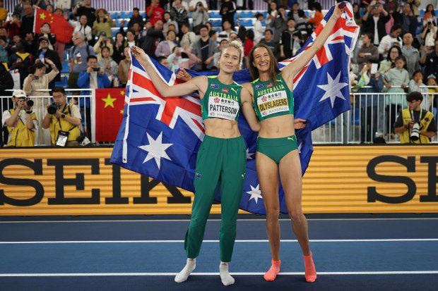 Silver medallist Eleanor Patterson (left) and gold medallist Nicola Olyslagers celebrate at the world athletics indoor championships.