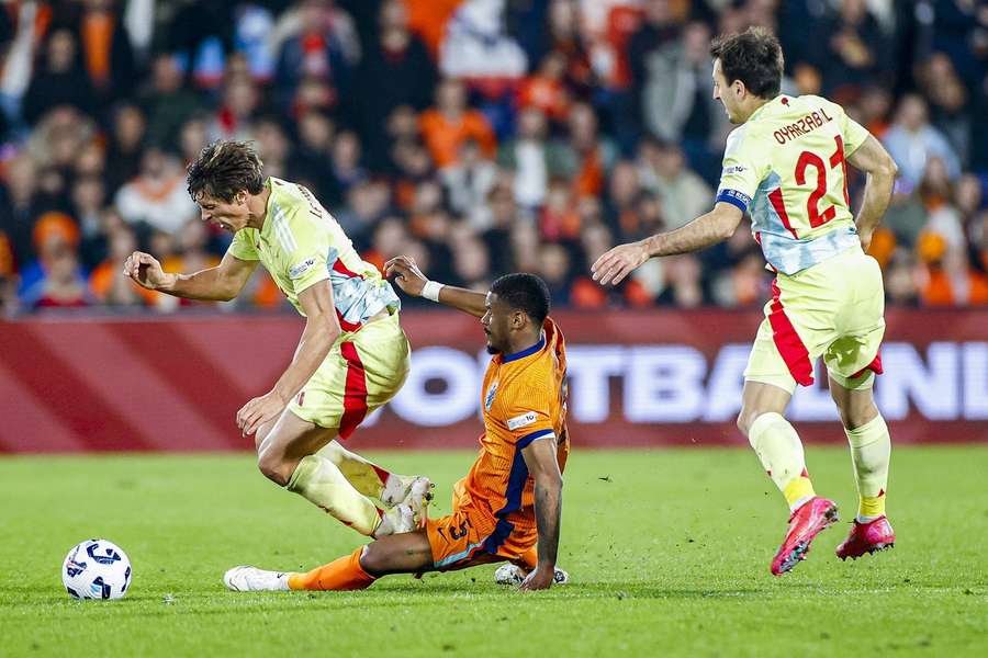 Jorrel Hato makes a late challenge on Robin Le Normand of Spain Jorrel Hato makes a late challenge on Robin Le Normand of Spain