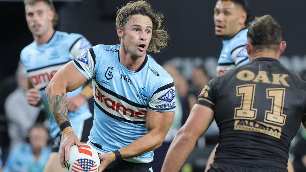 Nicho Hynes of the Sharks passes the ball.