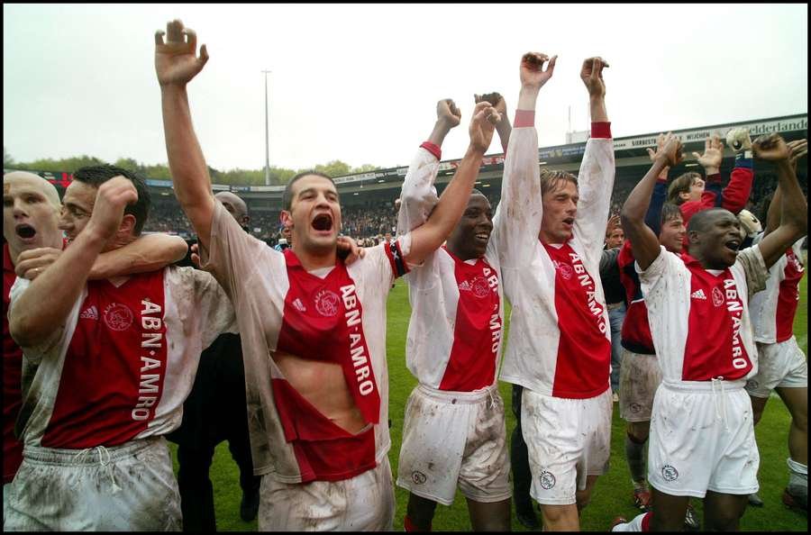 Cristi Chivu (second from left) celebrates winning the title with Ajax