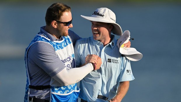 Joe Highsmith and his caddie, Joe LaCava Jr., celebrate on the 18th green together during the final round of The Cognizant Classic in The Palm Beaches at PGA National Resort the Champion Course on March 2, 2025 in Palm Beach Gardens, Florida. (Photo by Ben Jared/PGA TOUR via Getty Images)