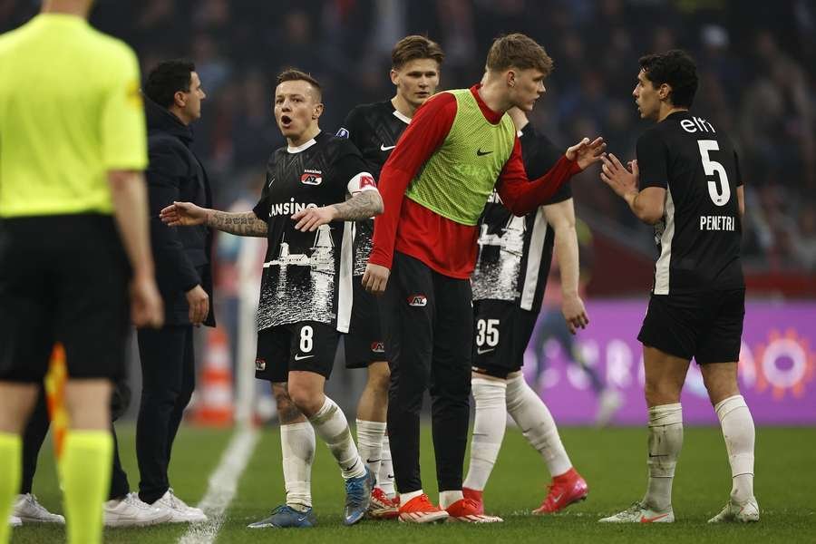 Several AZ players and manager Maarten Martens wanted to walk off the pitch after Alexandre Penetra got sent off Several AZ players and manager Maarten Martens wanted to walk off the pitch after Alexandre Penetra got sent off