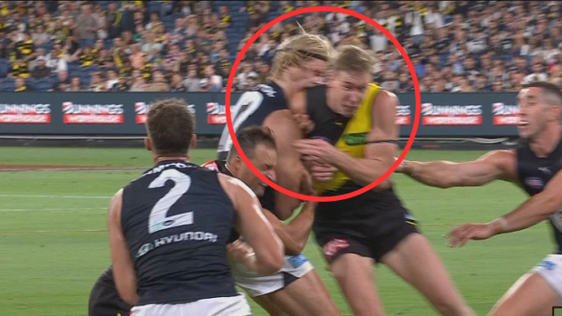 Tom Lynch makes high contact with Tom de Koning.