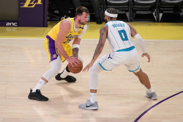 Luka Doncic sets up Charlotte Hornets' Miles Bridges.