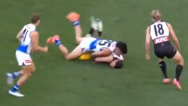 Josh Sinn of the Power is tackled by Paul Curtis of the Kangaroos during their round-seven match.