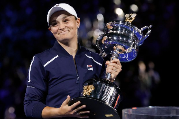 Ash Barty of Australia holds the Daphne Akhurst Memorial Cup after defeating Danielle Collins of the U.S., in the women's singles final at the Australian Open tennis championships in Saturday, Jan. 29, 2022, in Melbourne, Australia.