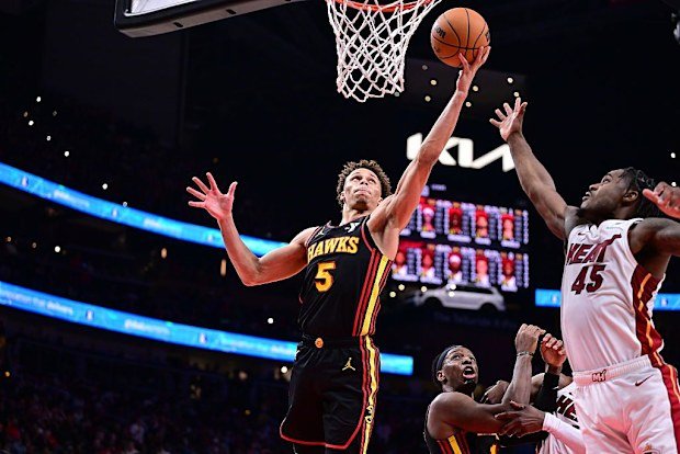 Dyson Daniels #5 of the Atlanta Hawks rebounds the ball.
