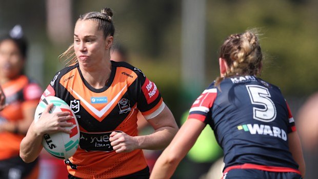 Kezie Apps of the Wests Tigers runs with the ball.