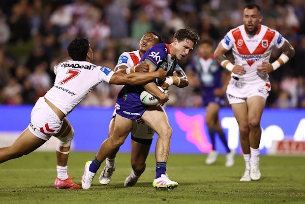 Luke Metcalf of the Warriors being tackled.