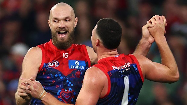 Steven May of the Demons celebrates with Max Gawn
