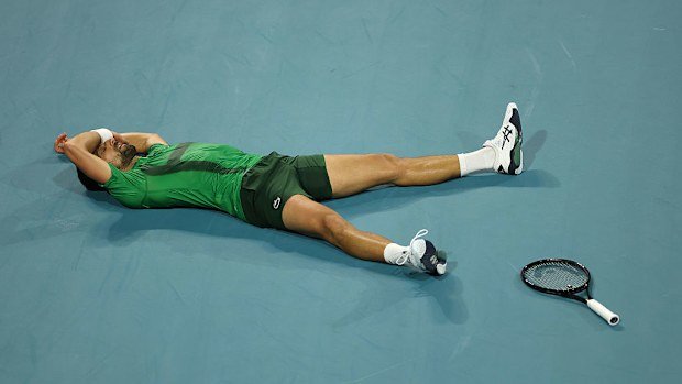 Novak Djokovic of Serbia lays on the court after losing a point against Jakub Mensik of the Czech Republic during the second set of the men's singles final on the final day of the Miami Open Presented by Itau 2025 at Hard Rock Stadium on March 30, 2025 in Miami Gardens, Florida. (Photo by Matthew Stockman/Getty Images)