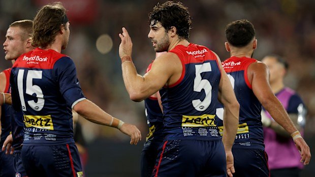MELBOURNE, AUSTRALIA - APRIL 24: Christian Petracca of the Demons is congratulated by teammates after scoring a goal during the round seven AFL match between Melbourne Demons and Richmond Tigers at Melbourne Cricket Ground, on April 24, 2025, in Melbourne, Australia. (Photo by Robert Cianflone/Getty Images)