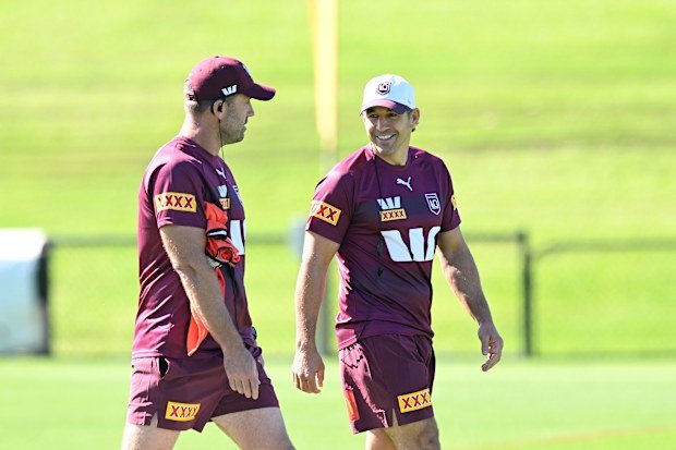 Coach Billy Slater converses with his assistant Josh Hannay during a training session.