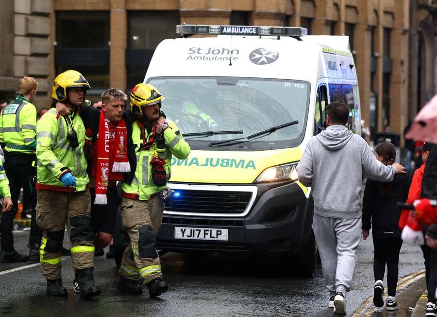 A fan is taken away by emergency services A fan is taken away by emergency services