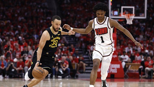 Stephen Curry of the Golden State Warriors dribbles during the fourth quarter in Game Seven of the Western Conference First Round NBA Playoffs.