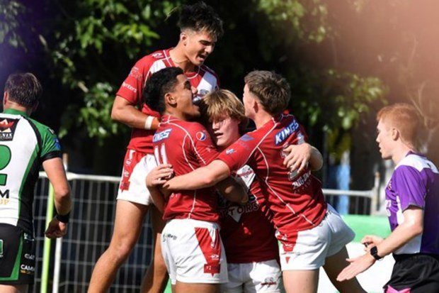 Brian Pouniu (11) celebrates with his Dolphins teammates during their grand final triumph in the 2024 Cyril Connell Cup.