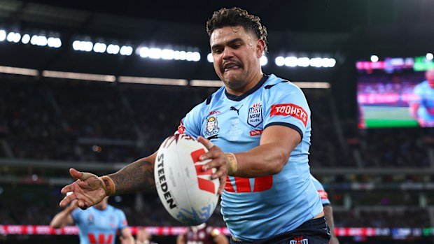 Latrell Mitchell celebrates scoring for the Blues.