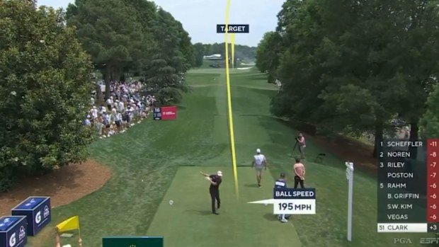 Wyndham Clark throws his club after hitting his tee shot on the par-4 16th at the PGA Championship, landing in a bunker.