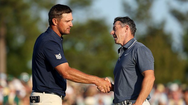 Bryson DeChambeau congratulates Rory McIlroy on his Masters win,
