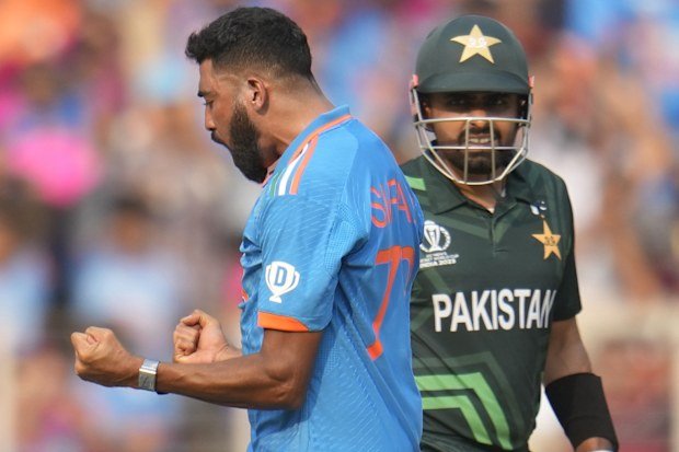 India's Mohammed Siraj celebrates the wicket of Pakistan's captain Babar Azam during the 2023 World Cup.