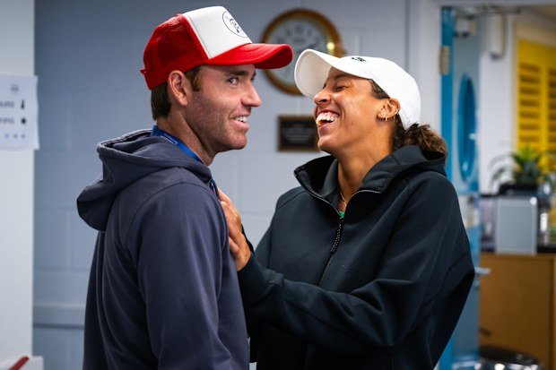 Madison Keys converses with Bjorn Fratangelo during a rain delay in Eastbourne.