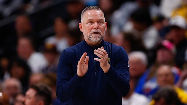 Coach Michael Malone claps on the sidelines during the third quarter against the Indiana Pacers