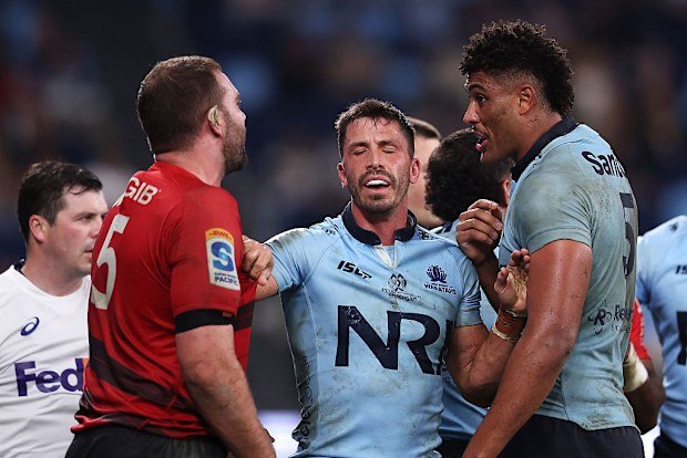 Jake Gordon of the Waratahs steps in as Antonio Shalfoon and Miles Amatosero exchange words.