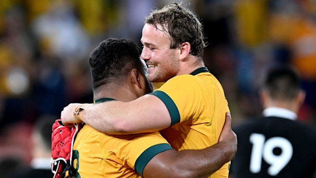 Harry Wilson and Taniela Tupou of the Wallabies celebrate victory.