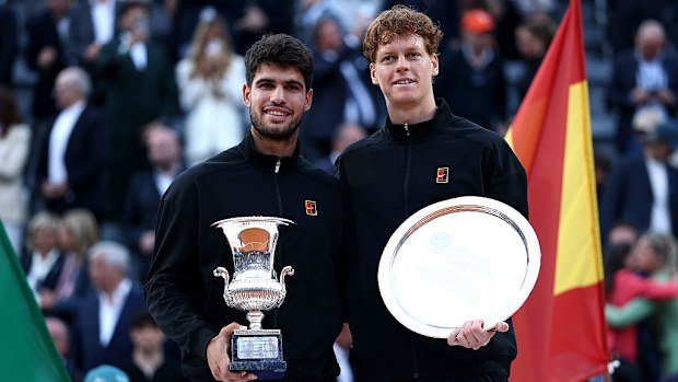 Carlos Alcaraz with the trophy celebrating victory alongside runner-up Jannik Sinner at the Rome Open.