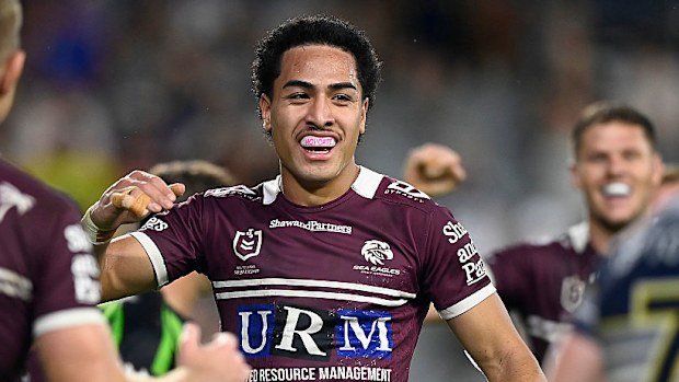 Lehi Hopoate of the Sea Eagles celebrates after scoring a try.
