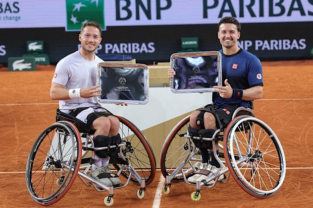 Alfie Hewett and Gordon Reid of Great Britain proudly display their trophy.