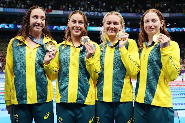 Lani Pallister, Brianna Throssell, Ariarne Titmus and Mollie O'Callaghan celebrating after winning gold in the 4x200m freestyle relay at the Paris 2024 Olympics.