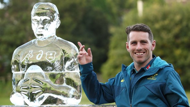 Bernard Foley with an 'Iceman' sculpture made in his honour.