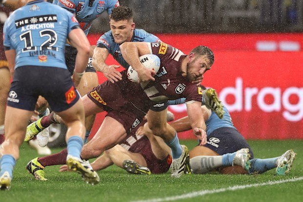 Kurt Capewell scores for the Maroons, adding to their tally before the break.