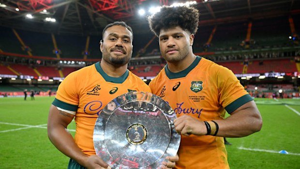Samu Kerevi and Rob Valetini of Australia pose for a photo with the James Bevan Trophy.