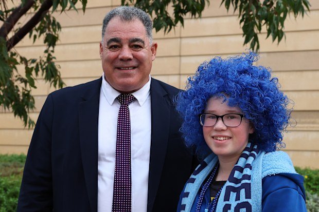 Perth Bears coach Mal Meninga with a Blues fan before game two of Origin.