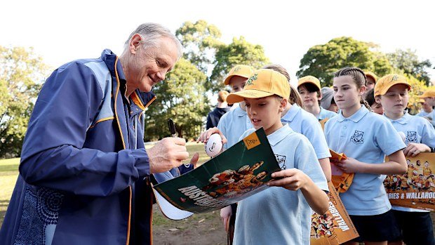 Wallabies coach Joe Schmidt signing autographs at Stanmore Public School.