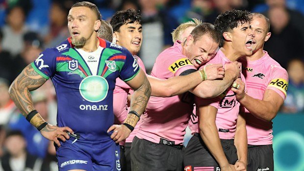 Blaize Talagi of the Panthers celebrates with teammates after scoring a try during the round 16 NRL match against the New Zealand Warriors in Auckland. (Photo by Phil Walter/Getty Images)