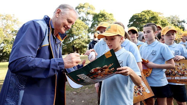Wallabies coach Joe Schmidt signs autographs at Stanmore Public School.