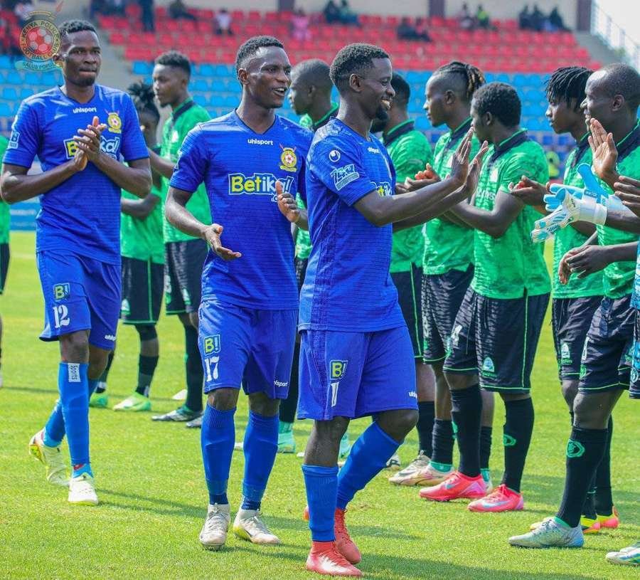 Kenya Police receive a guard of honour from Gor Mahia's players
